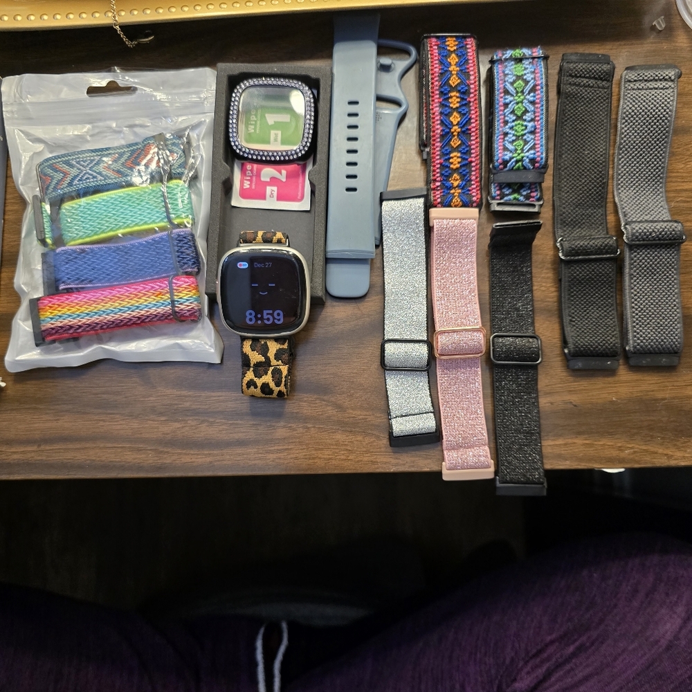 Fitbit Versa 4 with 13 bands and screen protector and charger!